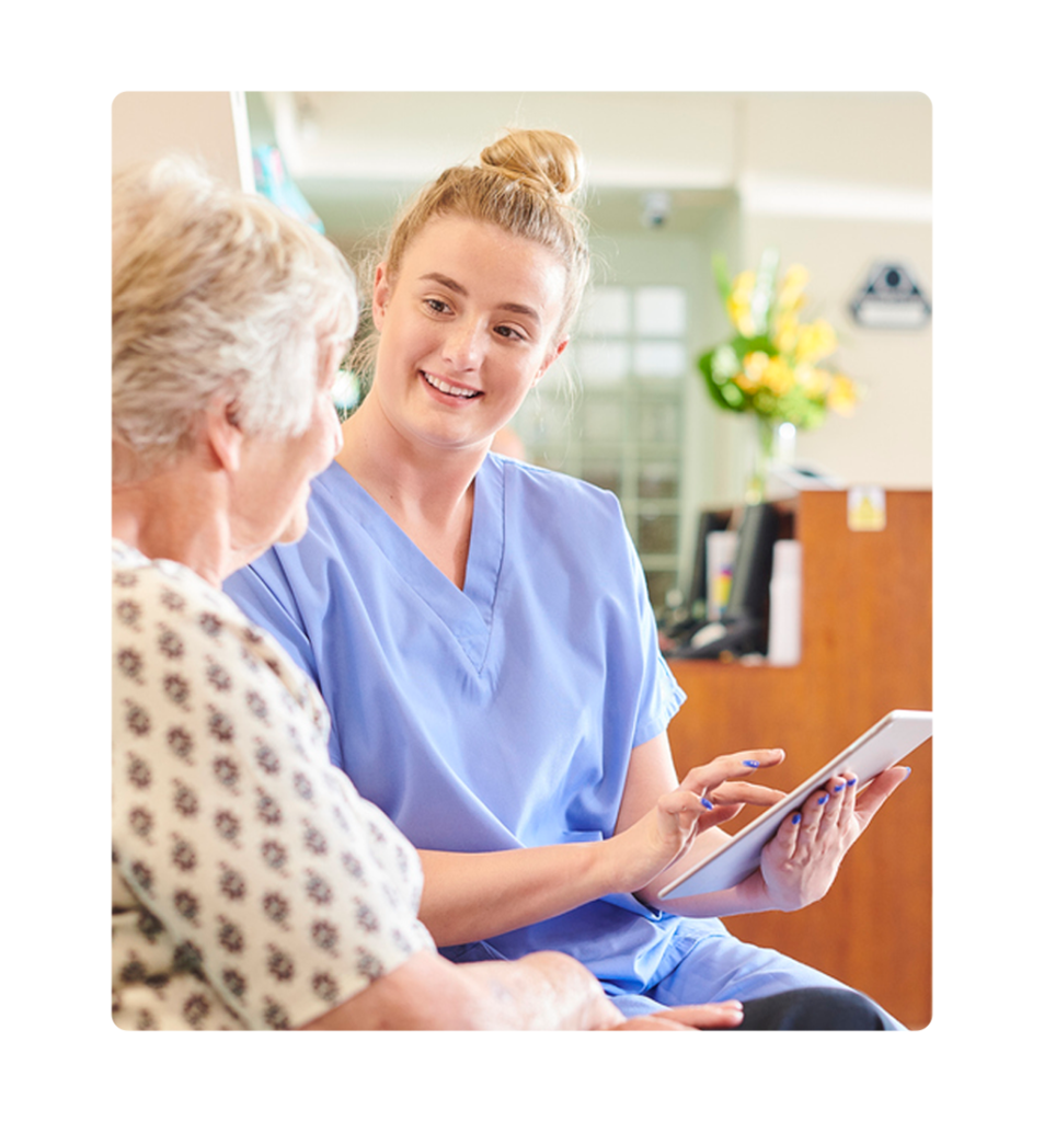 Practice Manager helping patient fill out an online form